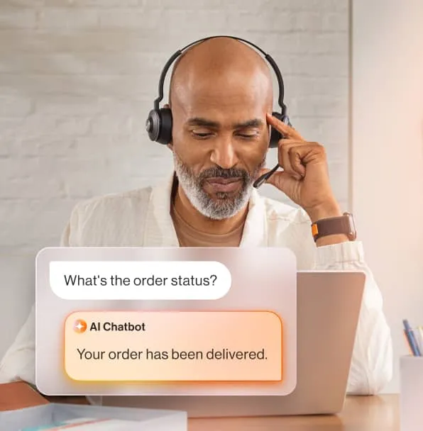 A customer checking order status on his laptop and receiving a response from an AI chatbot.