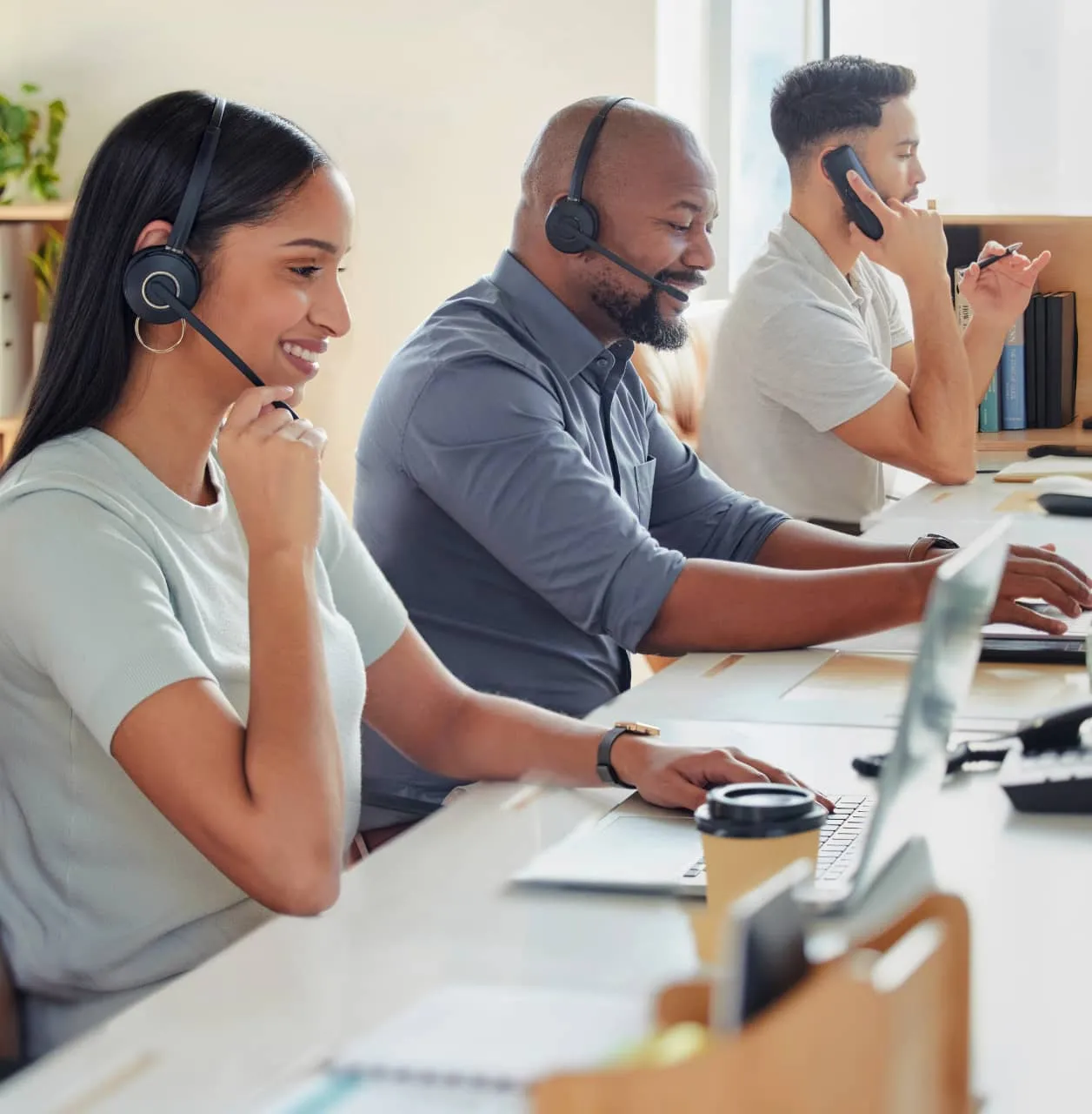 A group of contact center agents providing support to callers