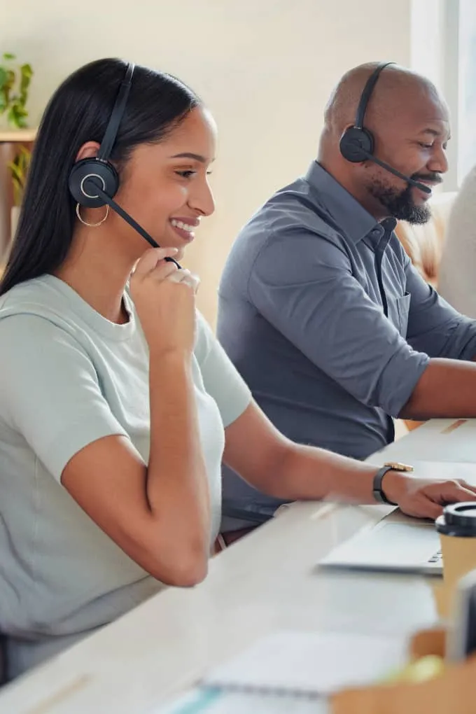 A group of contact center agents providing support to callers
