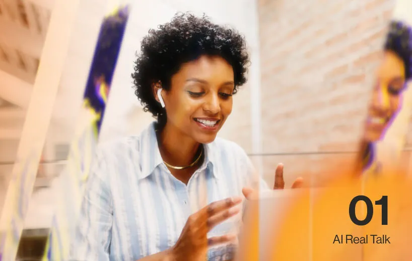A woman on a call using her laptop and earphone