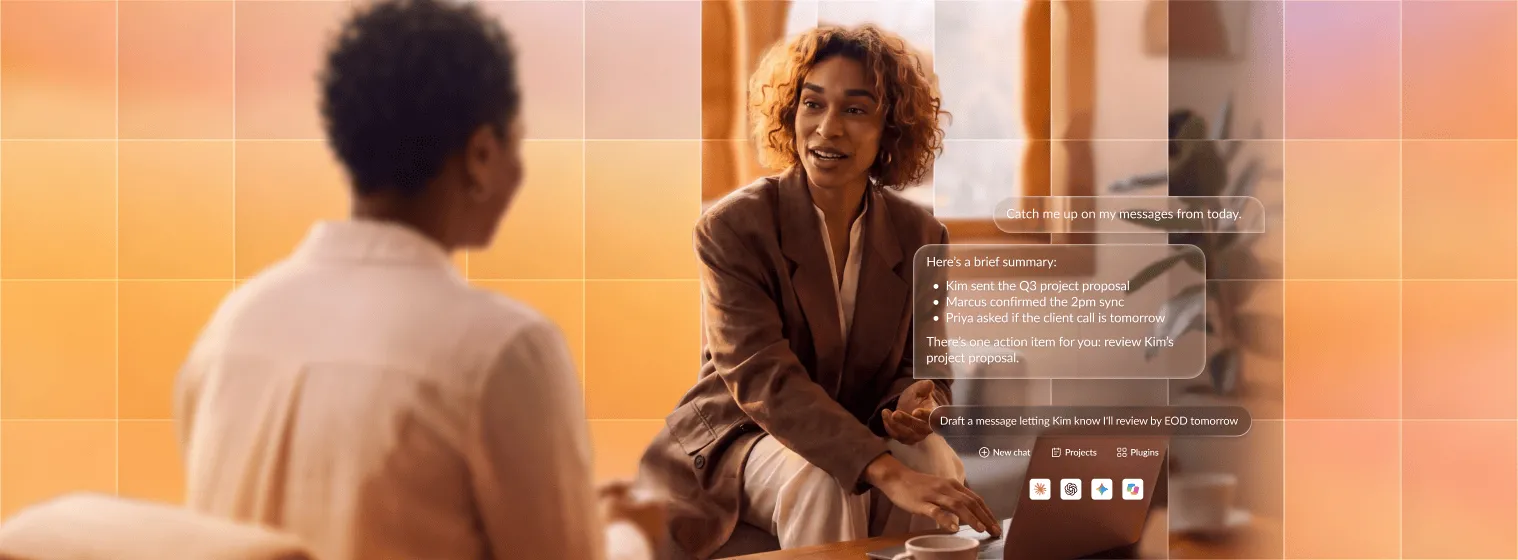 A professional discusses call summaries with a colleague using a laptop, showcasing RingCentral's team collaboration tools.