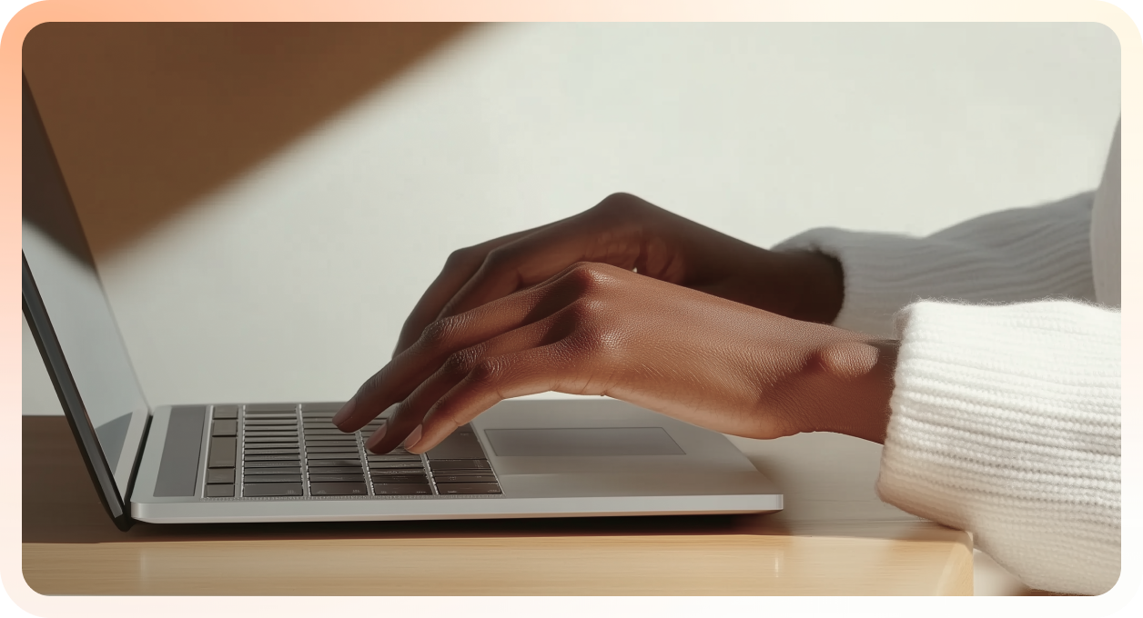 Female hands typing on a laptop keyboard