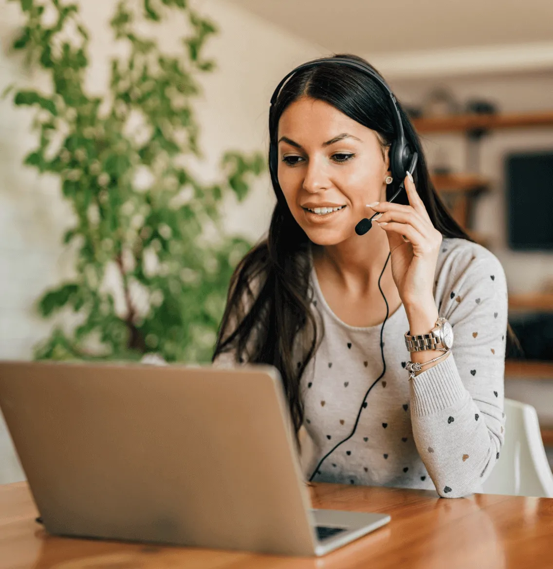 A female on a phone call using a headphone