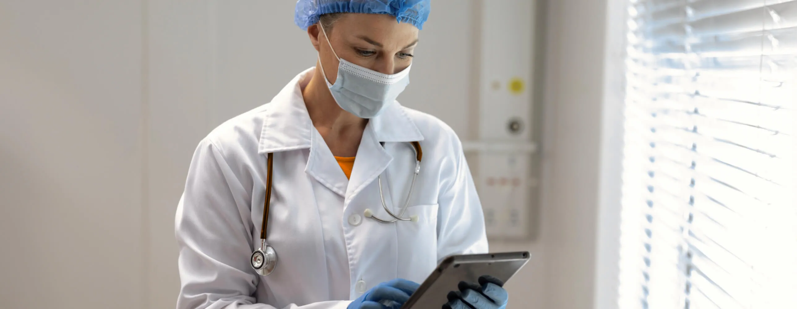 A female member of a contact tracing team communicates via the RingCentral app on a tablet