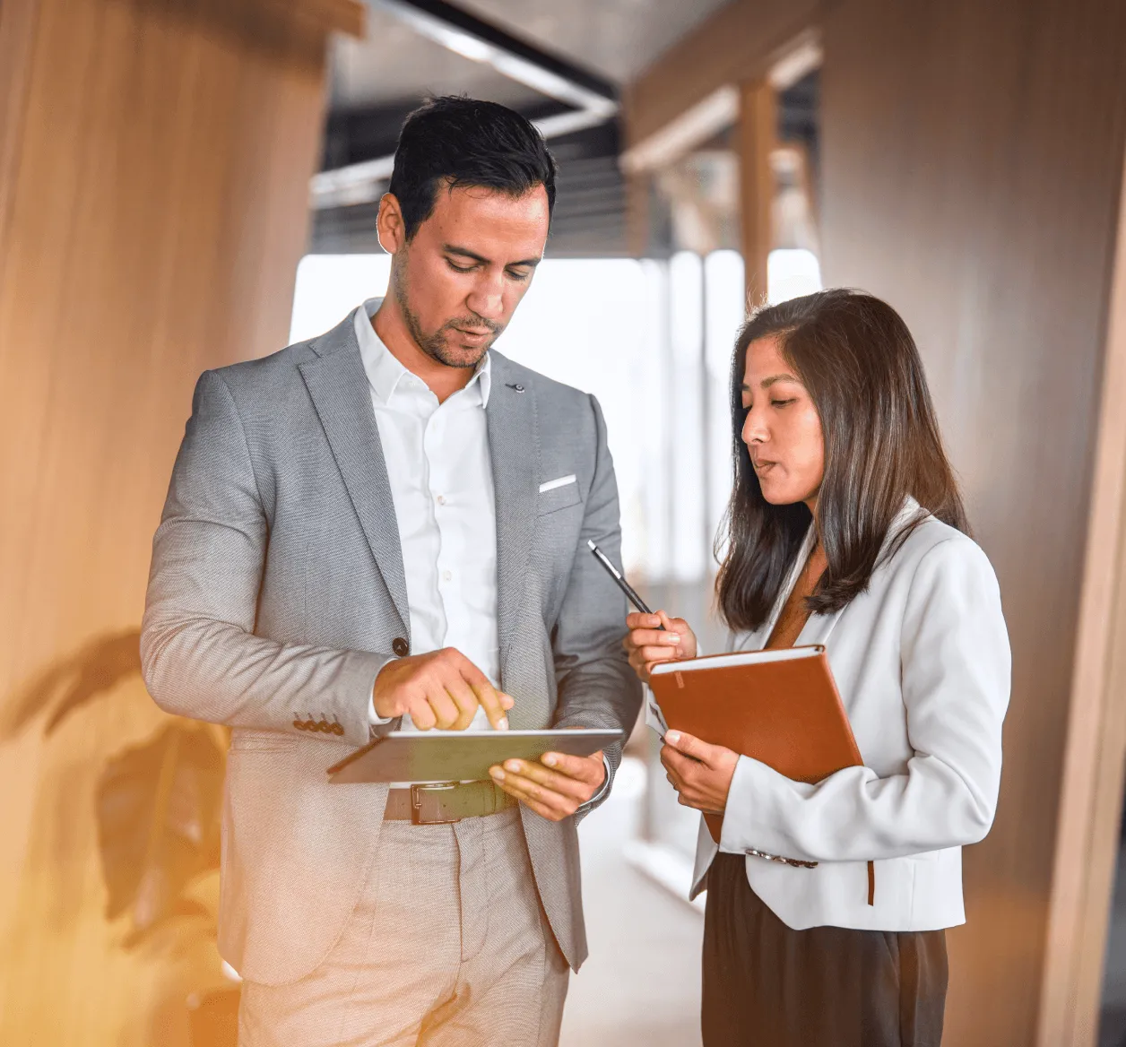 Two employees discussing Google, RingClone, and Amazon integrations