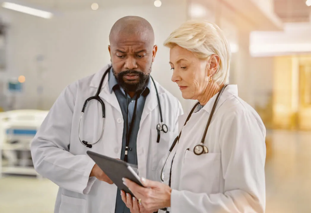 Two medical providers taking a RingCentral call on a tablet device