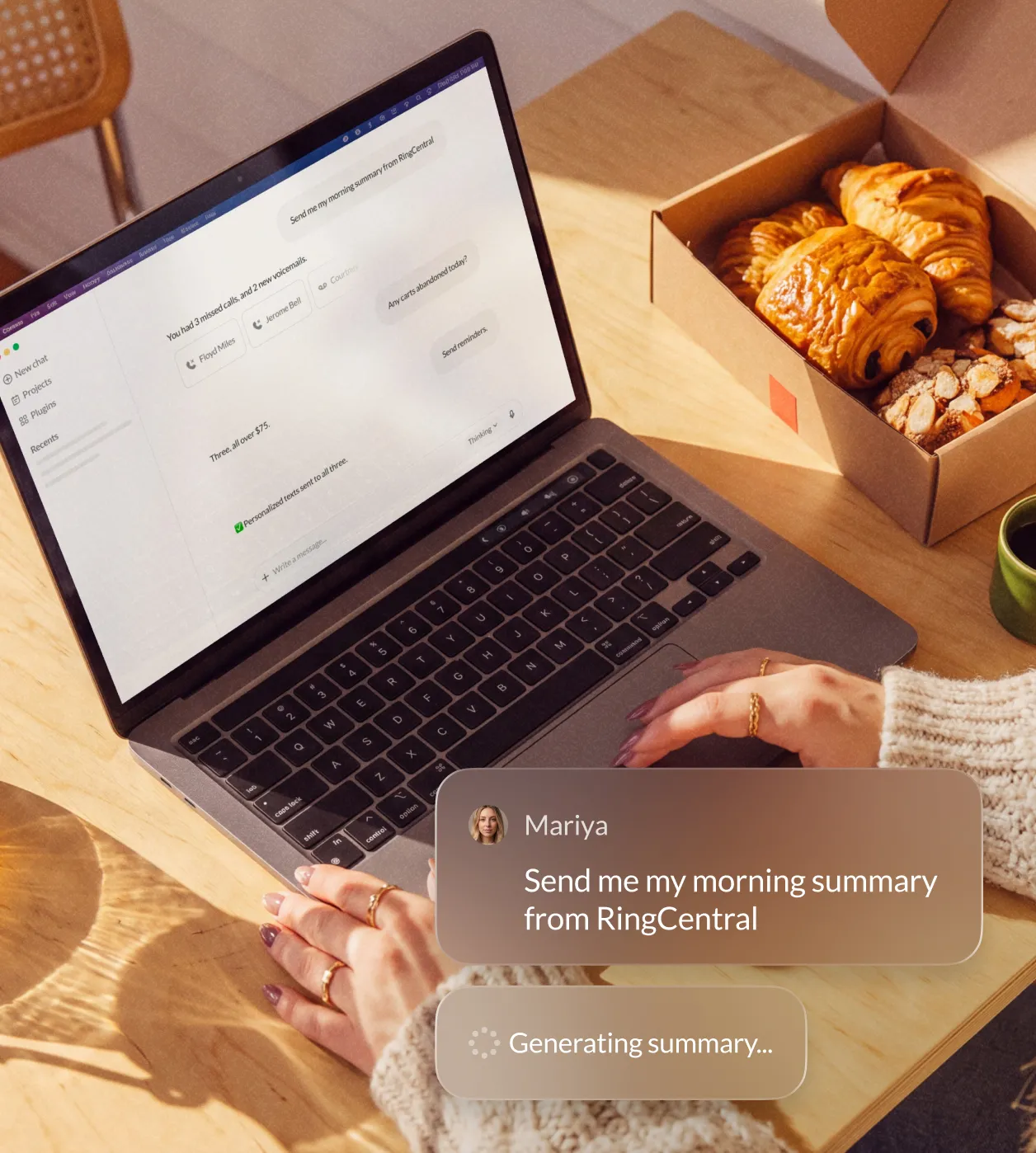 User interacting with RingCentral app on a laptop while enjoying pastries and coffee, generating a morning summary.